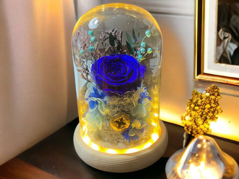 Preserved flowers in glass dome