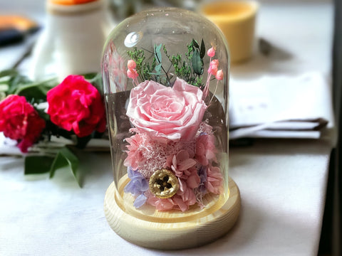 Preserved flowers in glass dome